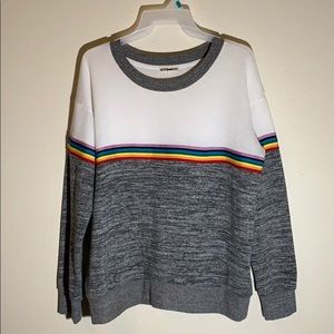 A grey and white long sleeve sweater